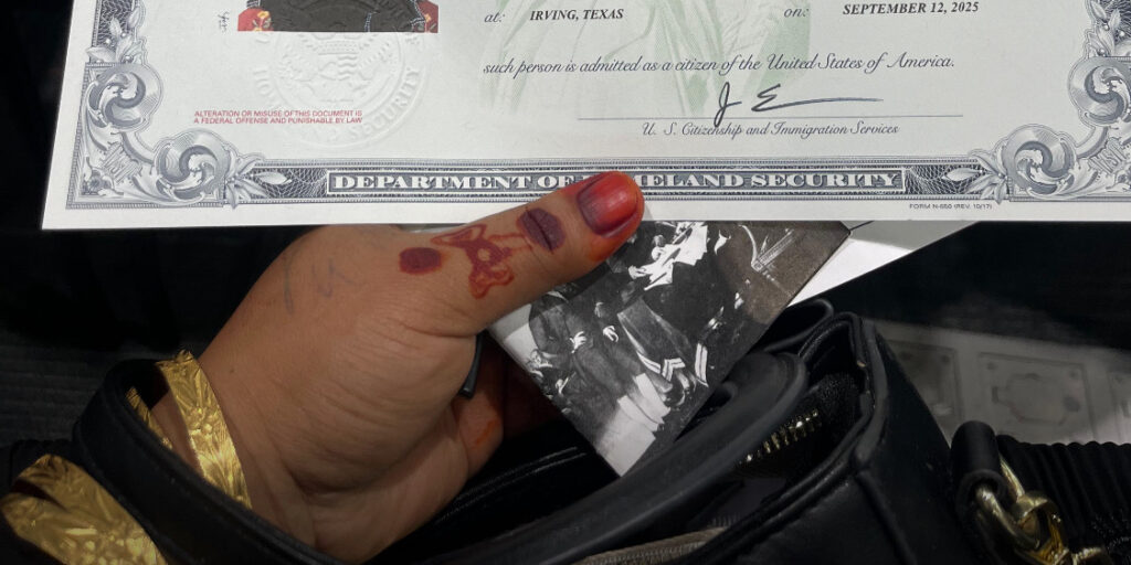 Rohingya woman holds citizenship certificate